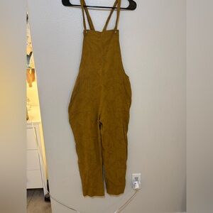 Women’s Little Cottonwood Jumpsuit in Mustard Yellow.